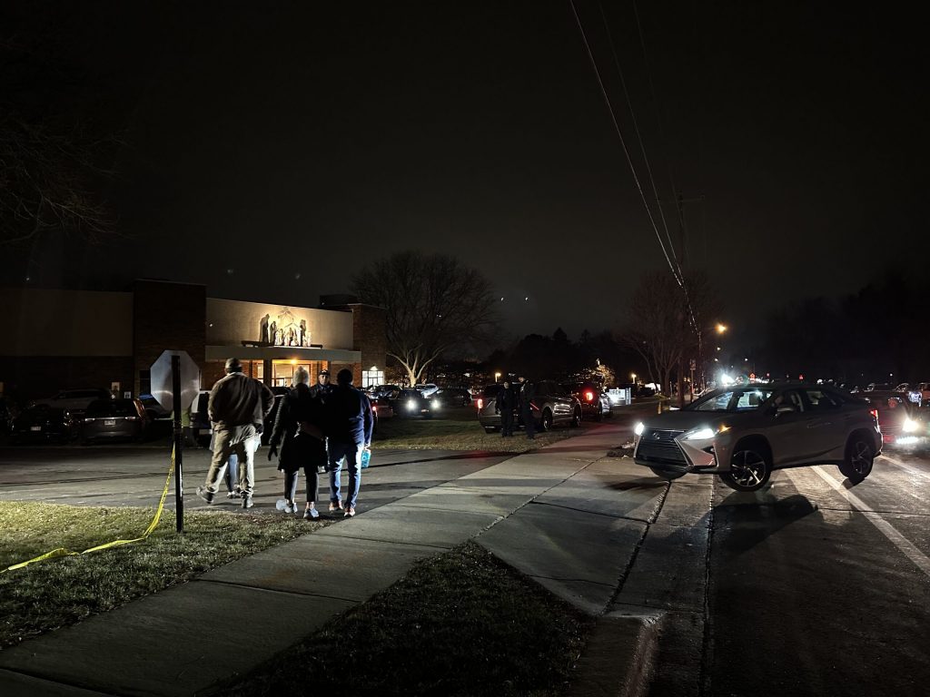 Mourners enter City Church on the east side of Madison, Wis., on Dec. 17, 2024, one day after a shooter killed two people at Abundant Life Christian School. The shooter was a student who is believed to have died of a self-inflicted gunshot. Anya van Wagtendonk/WPR