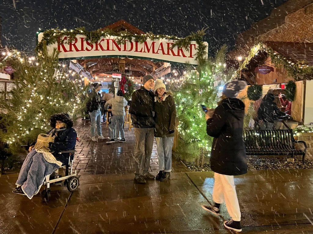 Attendees at Sparta’s Kriskindlmarkt visit vendors in huts built by market organizers. Photo courtesy Kriskindlmarkt