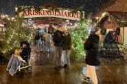 Attendees at Sparta’s Kriskindlmarkt visit vendors in huts built by market organizers. Photo courtesy Kriskindlmarkt