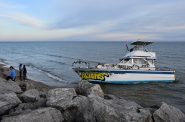 People look at the S.S. Minnow on Dec. 28. Photo by Jeramey Jannene.