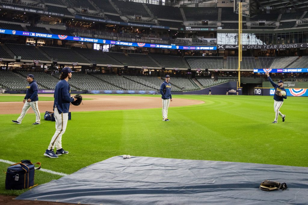 Brewers players warm up before their home opener against the Mets on Monday, April 3, 2023, at American Family Field in Milwaukee, Wis. Angela Major/WPR