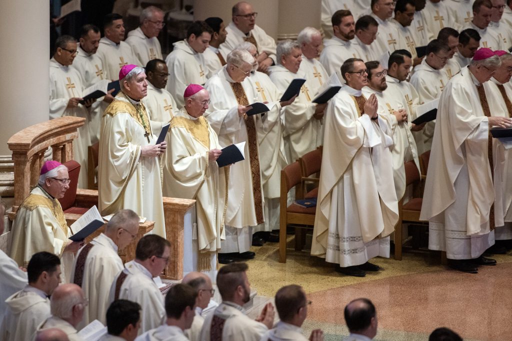 Jerome Listecki, left, the 11th archbishop of Milwaukee, stands during Jeffrey Grob’s installation as his successor on Tuesday, Jan. 14, 2025, at the Cathedral of Saint John the Evangelist in Milwaukee, Wis. Angela Major/WPR