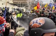 A member of the Capitol Police uses tear gas on rioters at the U.S. Capitol on Jan. 6, 2021. A group supporting law enforcement officers who defended the building has published ads ahead of Monday's inauguration urging members of Congress to oppose presidential pardons of the Capitol rioters. (Photo by Alex Kent/for Tennessee Lookout)