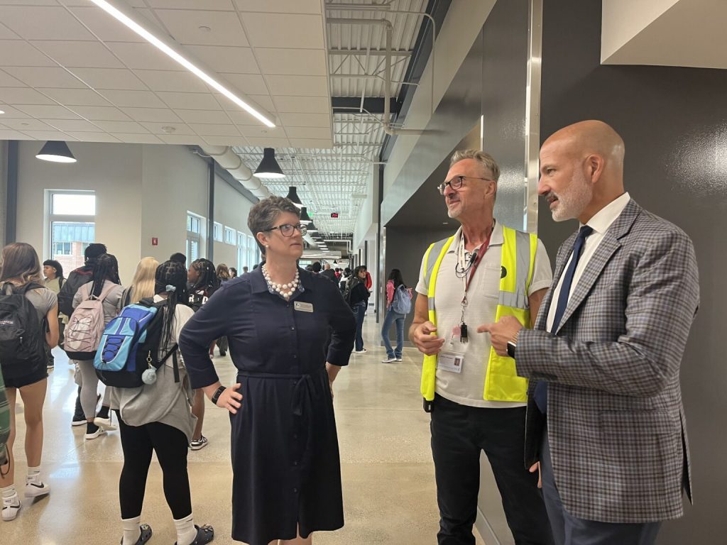 State Superintendent Jill Underly with Madison La Follette High School Principal Mathew Thompson and Madison Public School District Superintendent Joe Gothard in the hallway at La Follette in September 2024. Photo by Ruth Conniff/Wisconsin Examiner