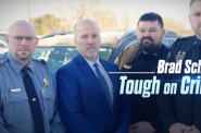 Wisconsin Supreme Court candidate Brad Schimel (second from left) stand next to Chippewa County Sheriff Travis Hakes (second from right), who has been at the center of numerous controversies. (Screenshot)