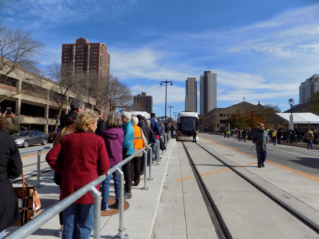 People wait in line to ride Milwaukee’s new streetcar dubbed The Hop. Ximena Conde/WPR