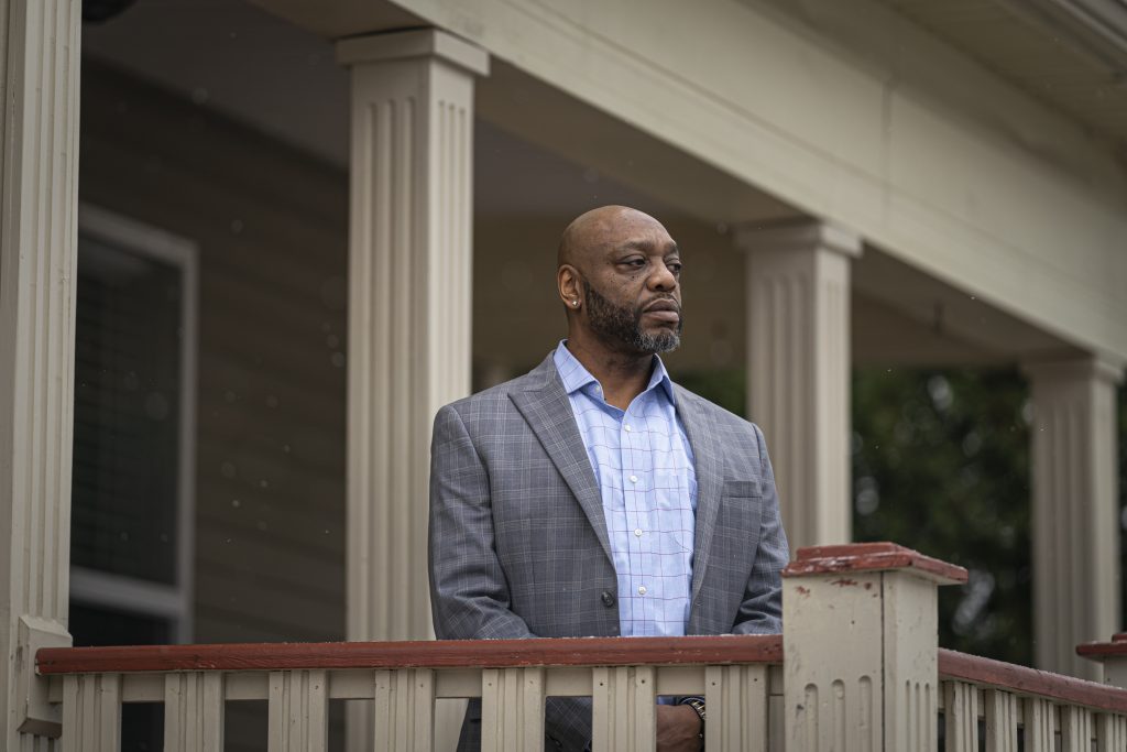 Kenneth Ginlack, executive director of Serenity Inns, poses outside a facility that houses men in a drug treatment program on Milwaukee’s North Side. The organization helps men by providing up to 20 hours of mental health and substance use treatment each week. (Andy Manis for Wisconsin Watch)