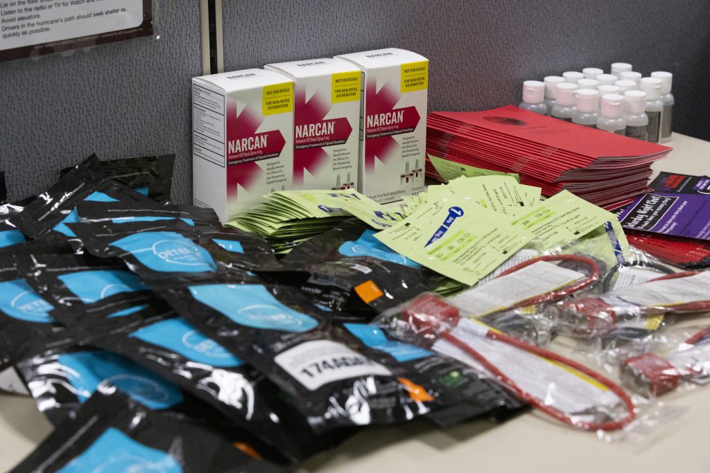 Boxes of Narcan are stored on a table in the Uniting Garden Homes Inc. office. (Joe Timmerman / Wisconsin Watch)