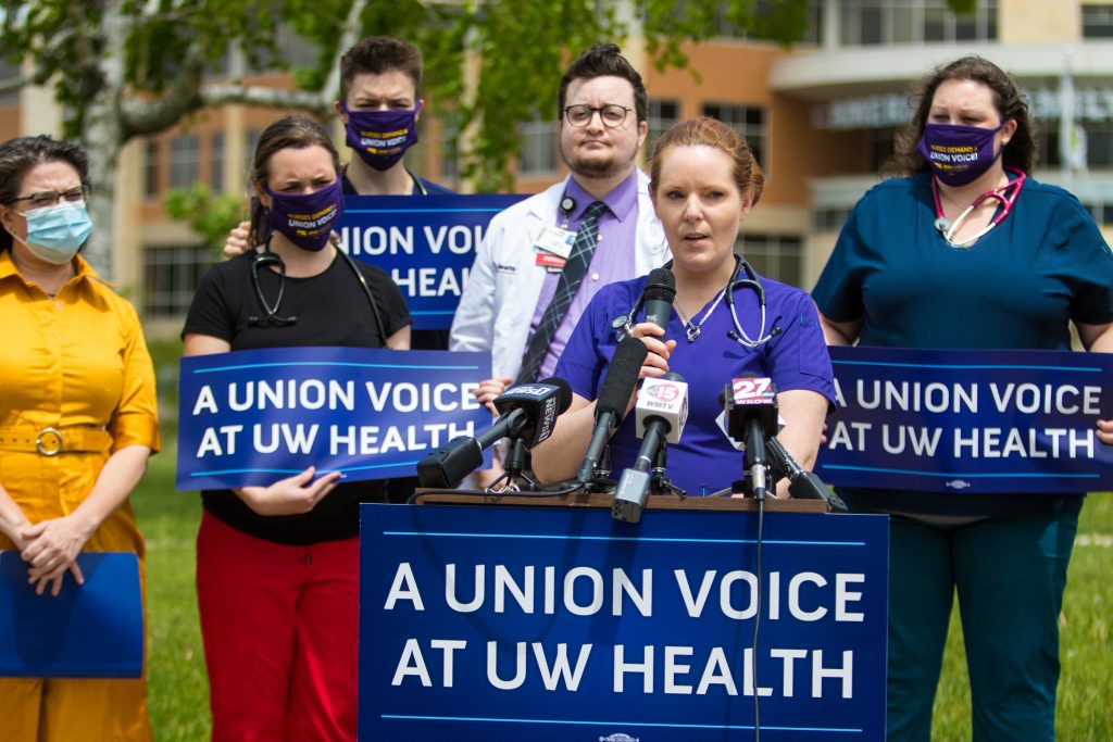 Registered nurse Tami Burns speaks during a May 2021 press conference calling on UW Health to recognize a nurses’ union. Around 2,500 nurses lost certification of their union in 2014 when their contract expired. Since then, UW Health has argued that Act 10 precludes the quasi-state health authority from signing a collective bargaining agreement with its workforce. Photo courtesy of SEIU Healthcare Wisconsin