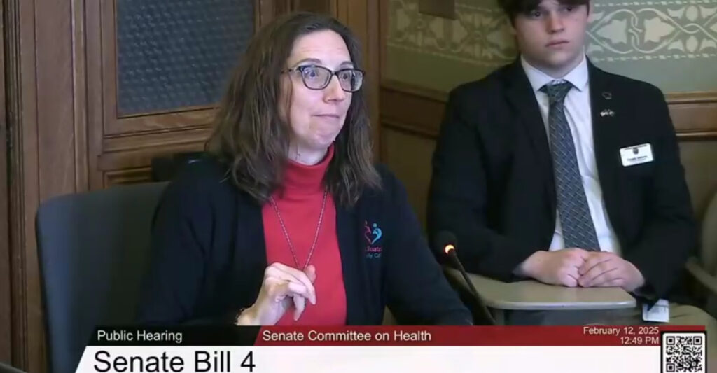 Dr. Wendy Molaska of Fitchburg testifies on Feb. 12 in support of legislation to clarify that doctors charging patients under a monthly subscription program are not in the insurance business. (Screenshot/WisEye)