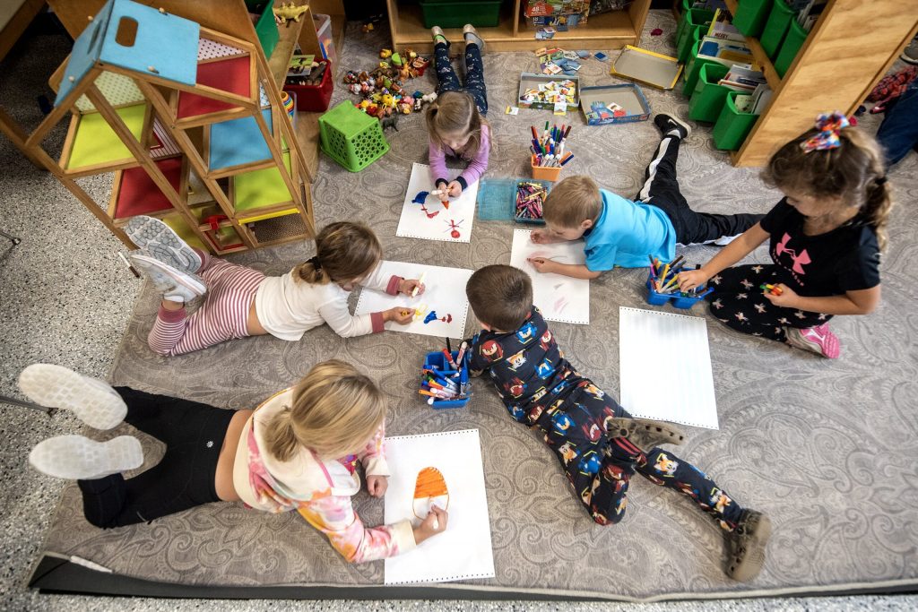 Preschool students draw pictures Friday, Oct. 27, 2023, at Wee Care Child Center in Waupun, Wis. Angela Major/WPR