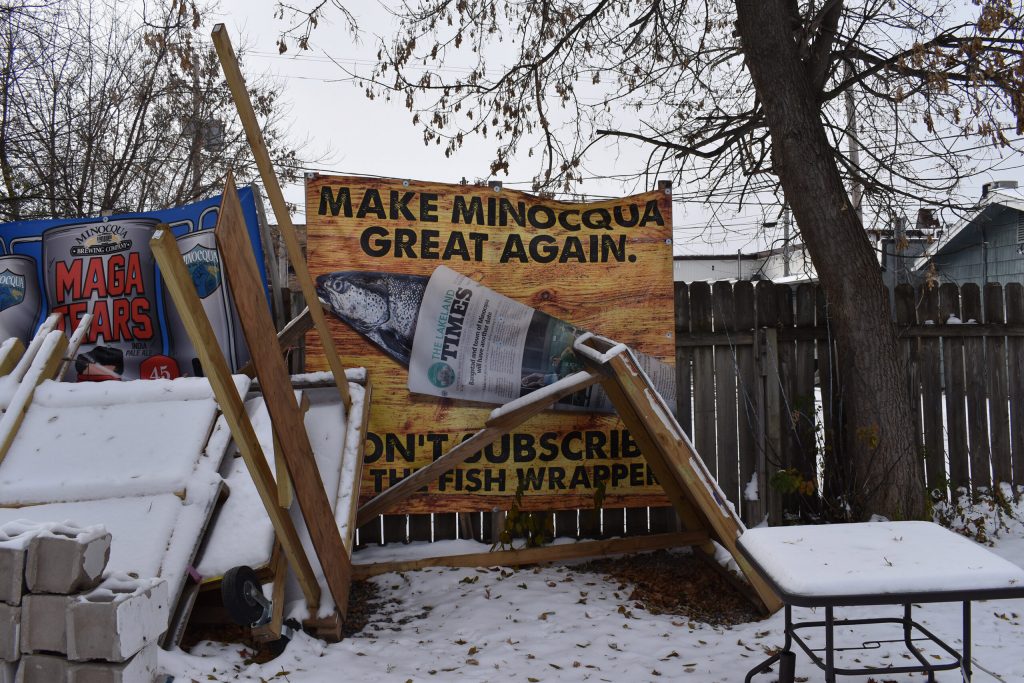 A sign outside Minocqua Brewing Company in Minocqua urges people to boycott the local newspaper. Rob Mentzer/WPR