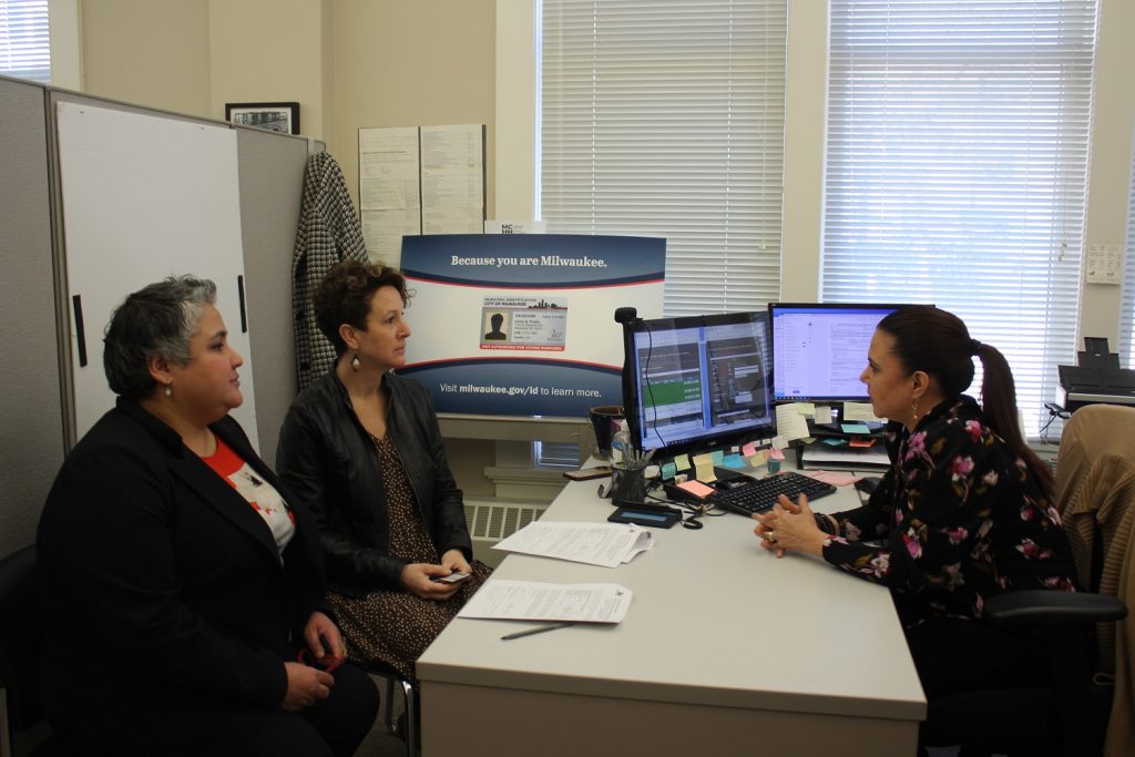 Alderwomen JoCasta Zamarripa (left) and Marina Dimitrijevic get their municipal IDs. Photo provided.