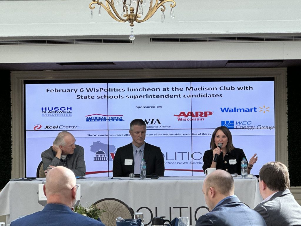 Jeff Mayers, left, president of WisPolitics, moderates a candidate forum featuring Sauk Prairie School District Superintendent Jeff Wright, center, and Brittany Kinser, a former special education teacher, at right, at the Madison Club on Thursday, Feb. 6, 2025. Anya van Wagtendonk/WPR