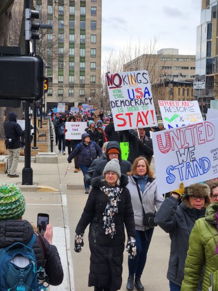 Protesters paraded around the Capitol Square that surrounds the state Capitol building in Madison Wednesday. (Photo by Erik Gunn/Wisconsin Examiner)