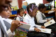 Children reading in Jacksonville, Florida with Teach for America. Business Wire