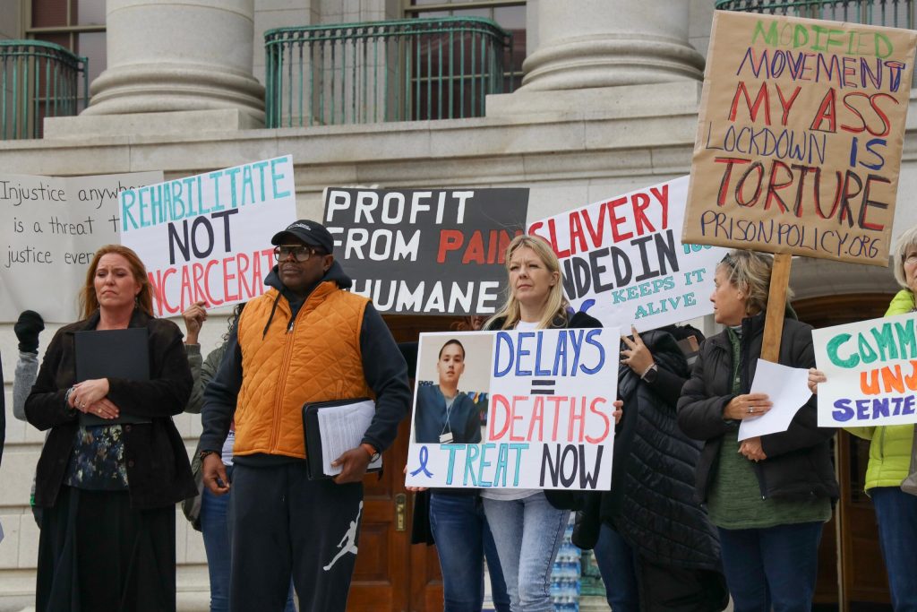 Protesters call on the short-staffed Wisconsin Department of Corrections to improve prisoner conditions and lift restrictions on prisoners’ movement during a protest at the Wisconsin State Capitol on Oct. 10, 2023, in Madison, Wis. Meryl Hubbard/Wisconsin Watch