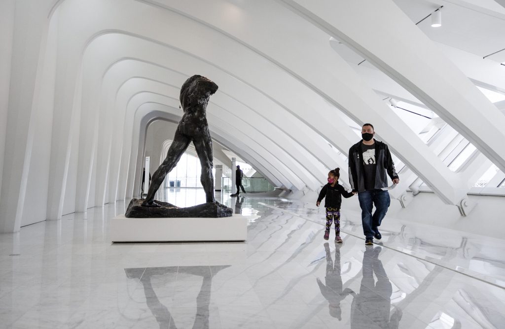 Paul Ducat and his daughter, Norah, walk to the galleries Friday, March 5, 2021, at the Milwaukee Art Museum. Angela Major/WPR