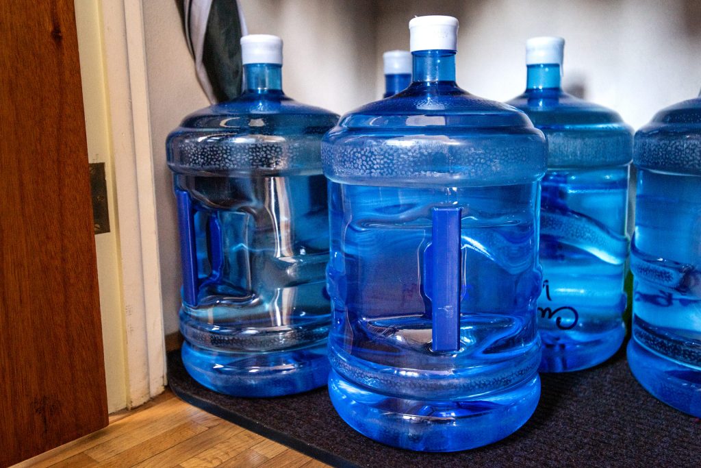 Water stored in a closet near Margie Walker and Jim Boisen’s kitchen in their French Island home Friday, Feb. 21, 2025. Angela Major/WPR