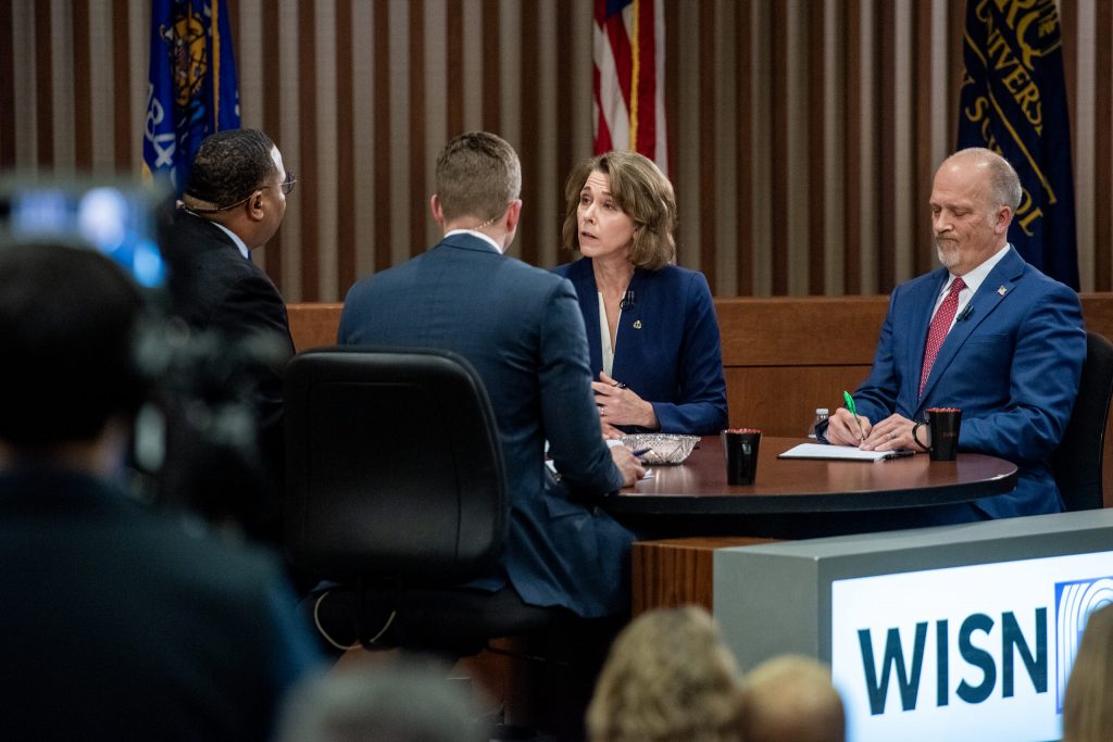 Susan Crawford and Brad Schimel participate in a debate Wednesday, March 12, 2025, at Marquette University in Milwaukee, Wis. Angela Major/WPR