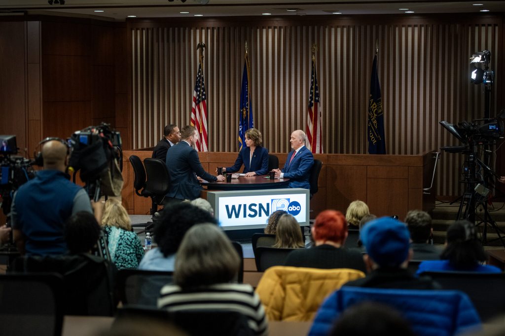 Susan Crawford and Brad Schimel participate in a debate Wednesday, March 12, 2025, at Marquette University in Milwaukee, Wis. Angela Major/WPR