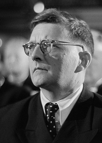 Dmitri Shostakovich's portrait, in the audience at the Bach Celebration of July 28, 1950. Photo by Roger & Renate Rössing, credit Deutsche Fotothek.(CC BY-SA 3.0 DE) <https://creativecommons.org/licenses/by-sa/3.0/de/deed.en>, via Wikimedia Commons