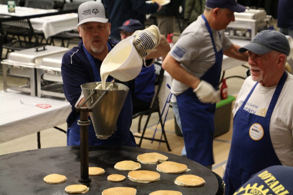 Conservative Wisconsin Supreme Court candidate Brad Schimel prepares for a pancake breakfast with his fellow Waukesha Rotary Club members on Feb. 22, 2025. Rich Kremer/WPR