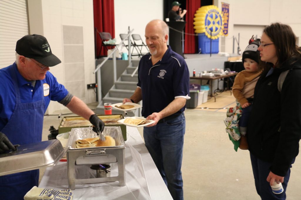 Conservative Supreme Court candidate Brad Schimel talks to voters at the Waukesha Rotary pancake breakfast on Feb. 22, 2025. Rich Kremer/WPR