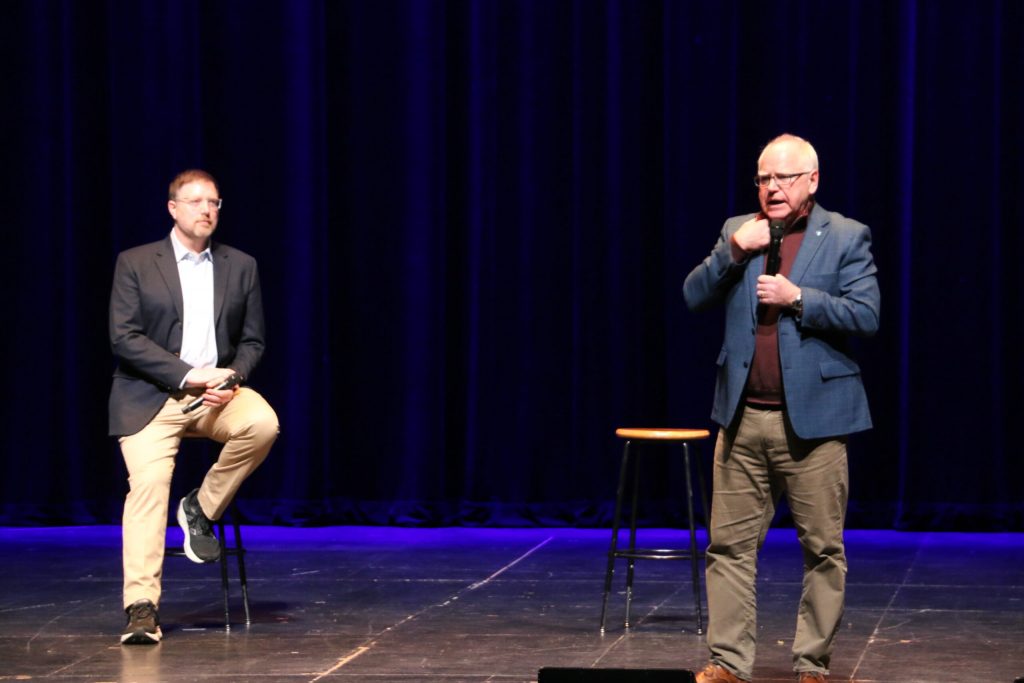 Minnesota Gov. Tim Walz speaks with Democratic Party of Wisconsin Chair Ben Wikler at a rally on Tuesday, March 18, 2025, in Eau Claire, Wisc. Rich Kremer/WPR