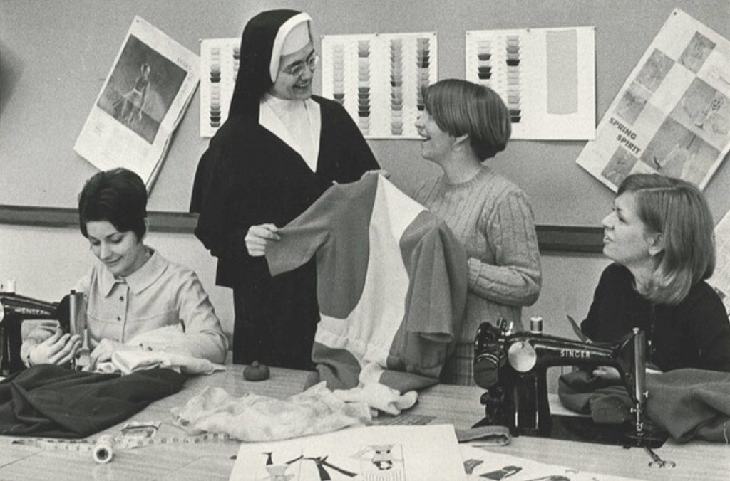 S. Aloyse Hessburg pictured with MMU fashion students. Photo courtesy of Mount Mary University.