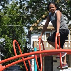 A child climbs the new play structure at Columbia Playfield. Photo taken August 17th, 2019 by Jack Fennimore.