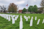 Simulated gravestones are arrayed in front of the Madison Labor Temple on Monday, April 28, 2025, to commemorate Workers Memorial Day. (Photo by Erik Gunn/Wisconsin Examiner)