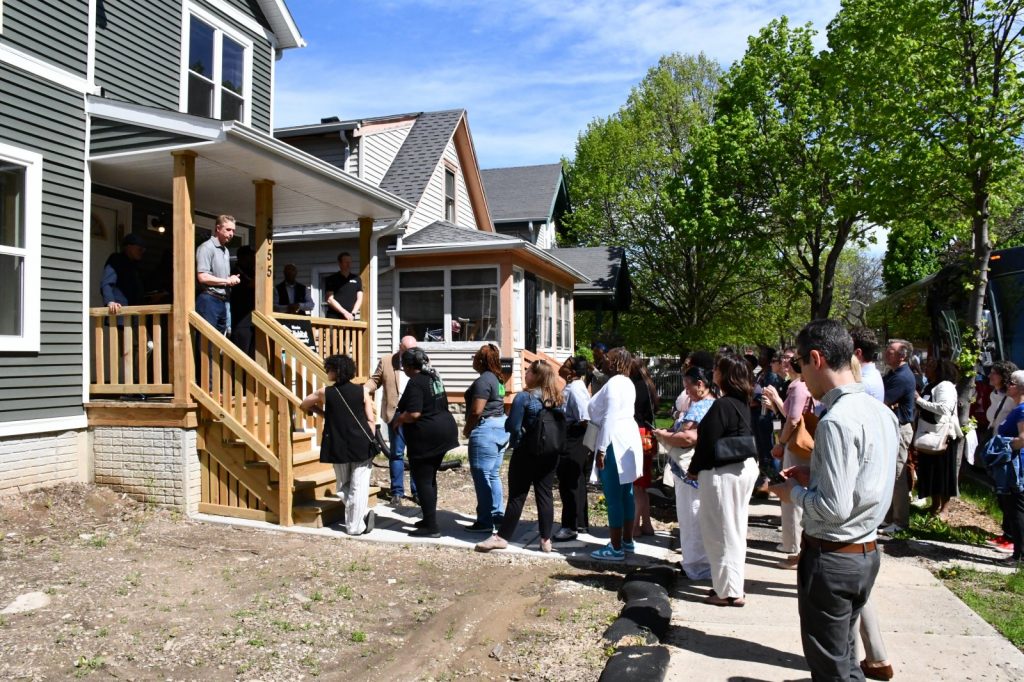 Community Development Alliance tour outside a Milwaukee Habitat for Humanity home. Photo by Jeramey Jannene.