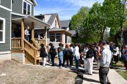 Community Development Alliance tour outside a Milwaukee Habitat for Humanity home. Photo by Jeramey Jannene.