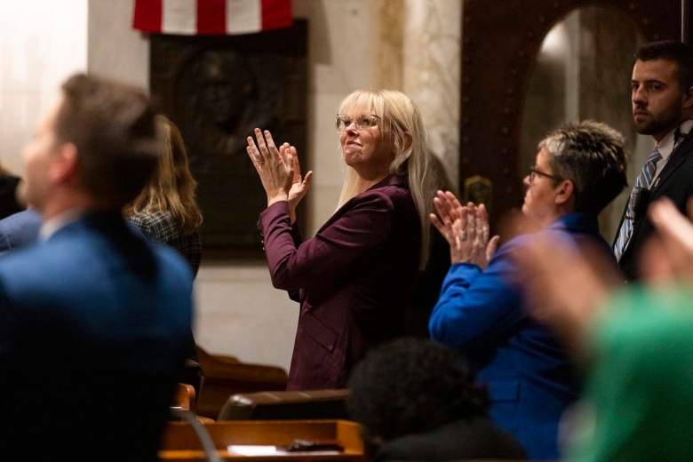 Sen. Sarah Keyeski, D-Lodi, applauds as Gov. Tony Evers delivers the 2025 state budget address, Feb. 18, 2025, at the Wisconsin State Capitol in Madison, Wis. She is sponsoring a bill seeking to bring down house prices in Wisconsin. (Joe Timmerman / Wisconsin Watch)