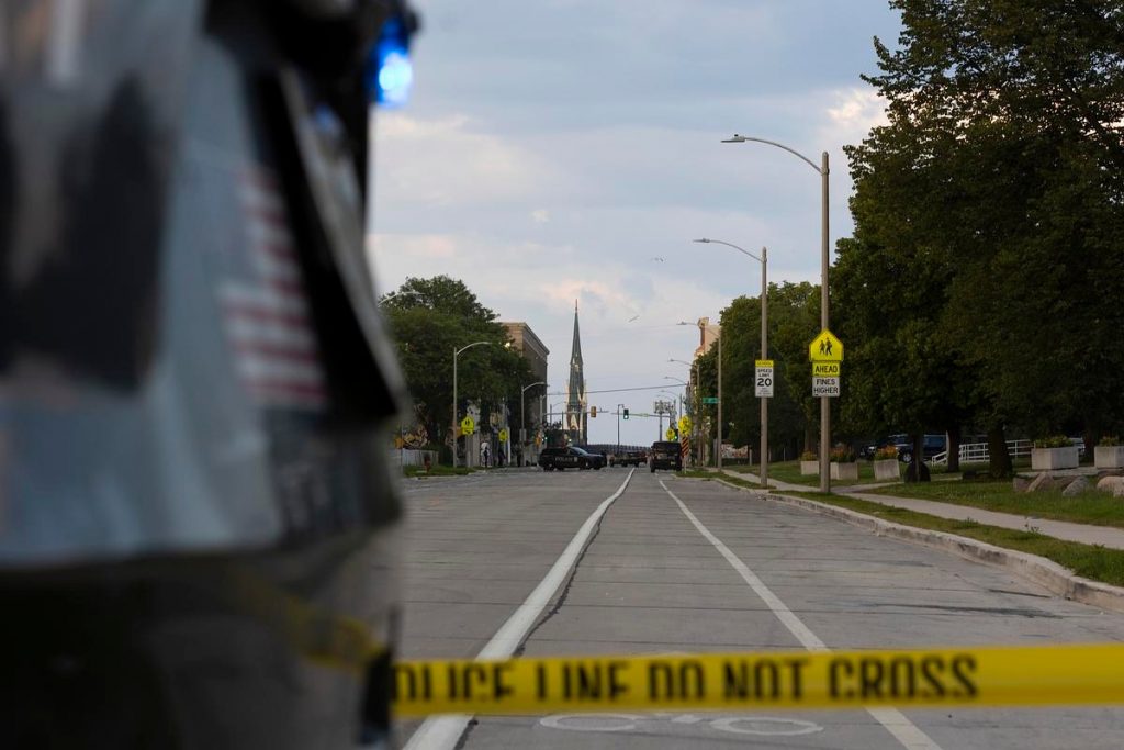 Police tape surrounds the perimeter of the site of a shooting death July 16, 2024, in Milwaukee. (Joe Timmerman / Wisconsin Watch)