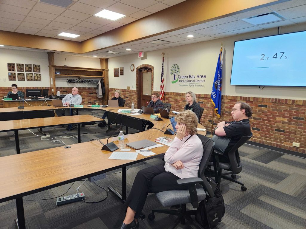 Members of the Green Bay School Board listen to public comment on Feb. 26, 2024. Joe Schulz/WPR
