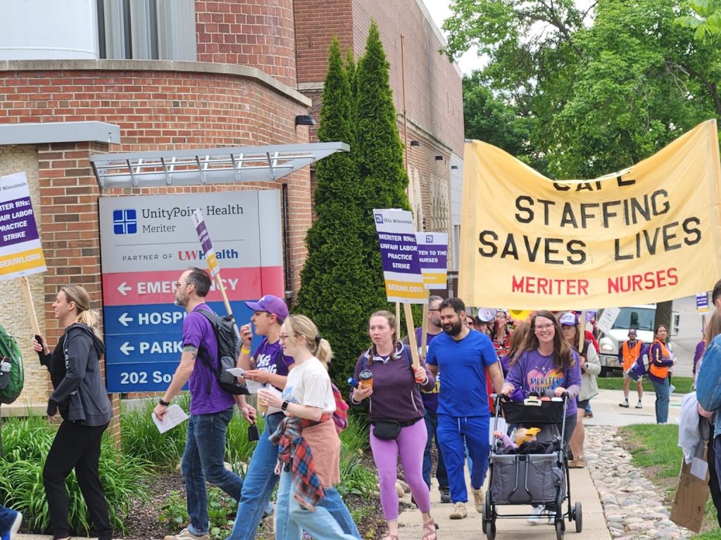 Striking nurses and supporters circle the UnityPoint Health-Meriter hospital in Madison on the first day of a five-day walkout Tuesday. (Photo by Erik Gunn/Wisconsin Examiner)