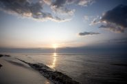 The sun rises over Lake Michigan at Kohler-Andrae State Park on Sunday, July 23, 2023, in Sheboygan, Wis. Angela Major/WPR