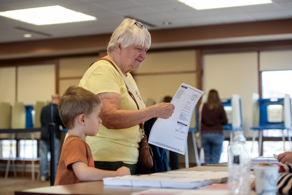 A voter receives a ballot Tuesday, Nov. 5, 2024, in New Berlin, Wis. Angela Major/WPR