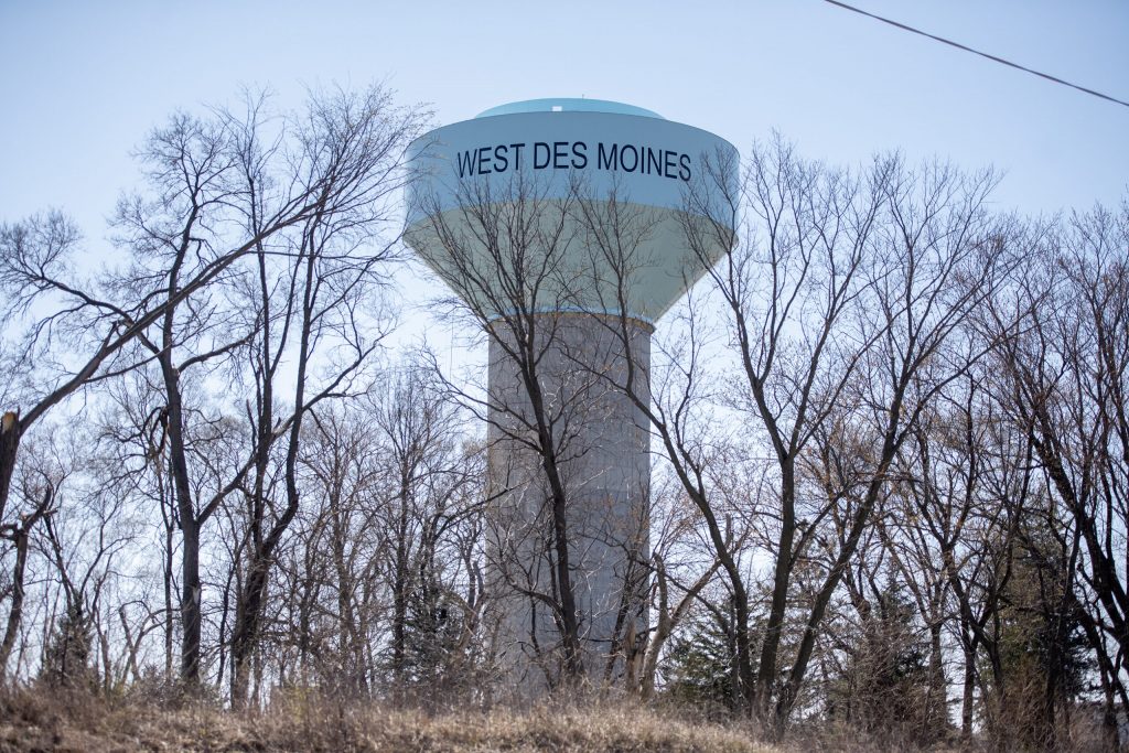 A water tower rises above the trees Tuesday, April 8, 2025, in West Des Moines, Iowa. Angela Major/WPR
