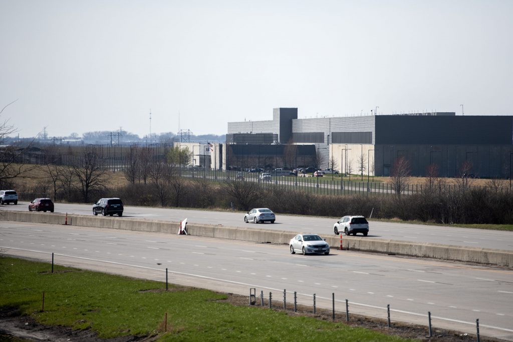 Cars pass by a Meta data center Tuesday, April 8, 2025, in Altoona, Iowa. Angela Major/WPR