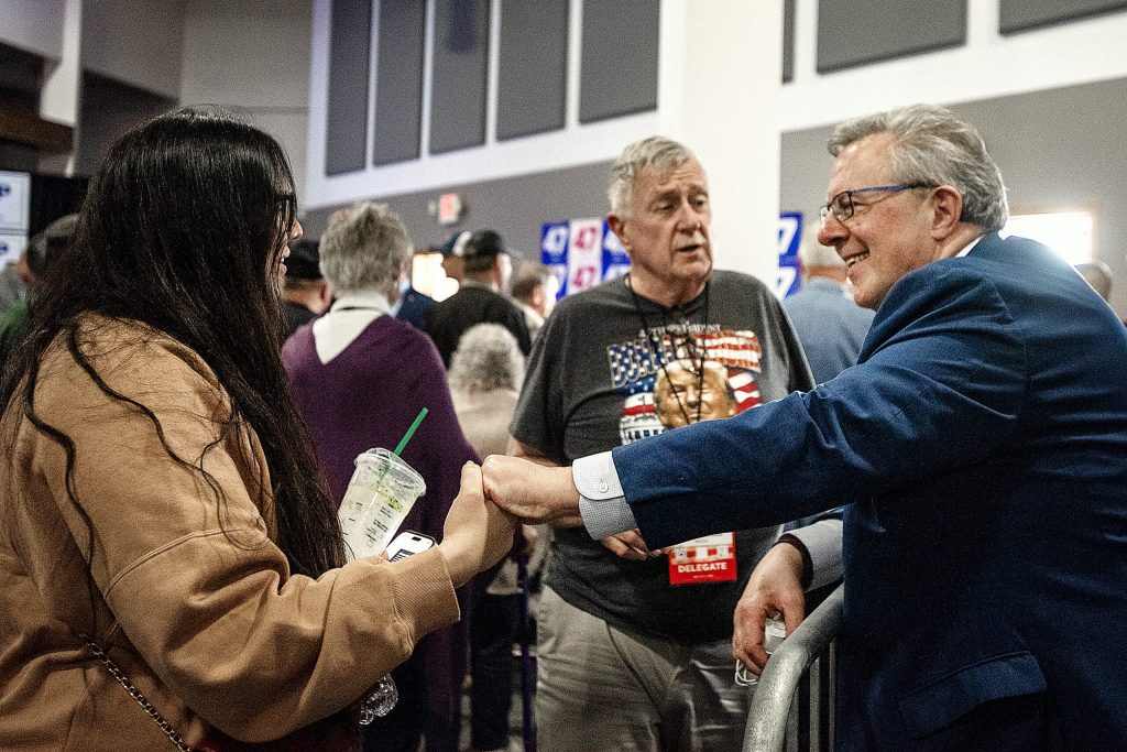 Republican Party of Wisconsin Chair Brian Schimming, right, greets attendees Saturday, May 17, 2025, during the Republican Party of Wisconsin State Convention in Rothschild, Wis. Angela Major/WPR