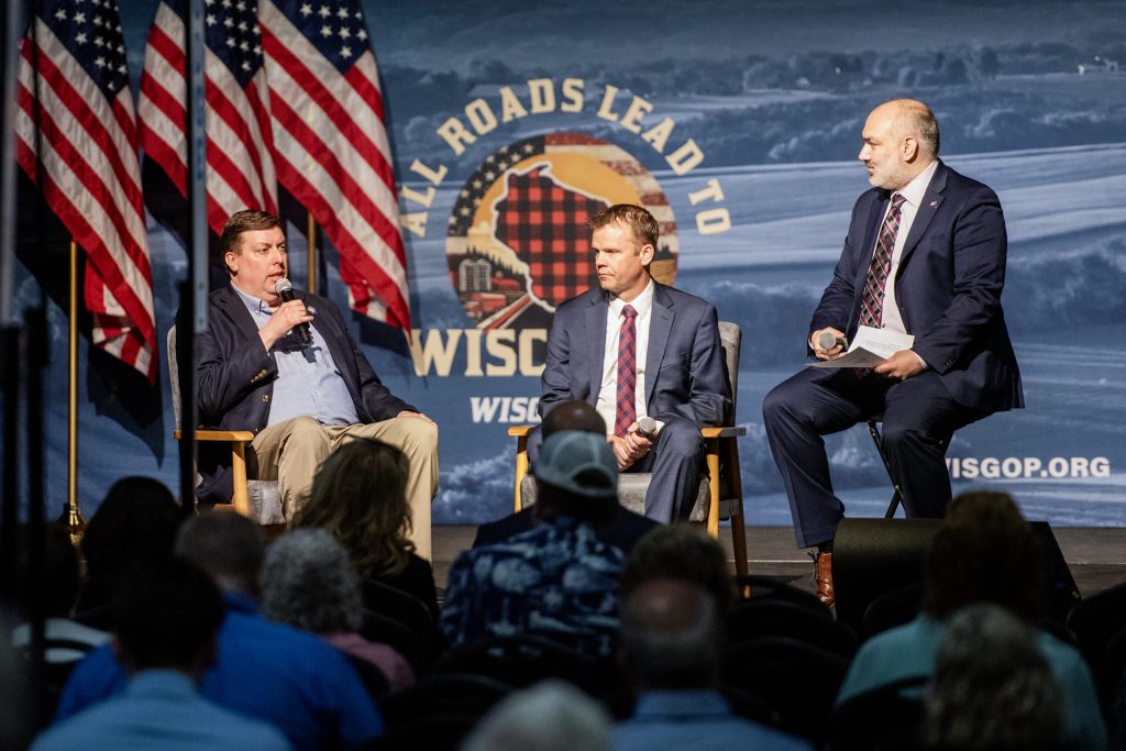 Wisconsin Treasurer John Leiber, right, leads a panel with Rep. Mark Born, left, and Sen. Devin LeMahieu, center, Saturday, May 17, 2025, during the Republican Party of Wisconsin State Convention in Rothschild, Wis. Angela Major/WPR