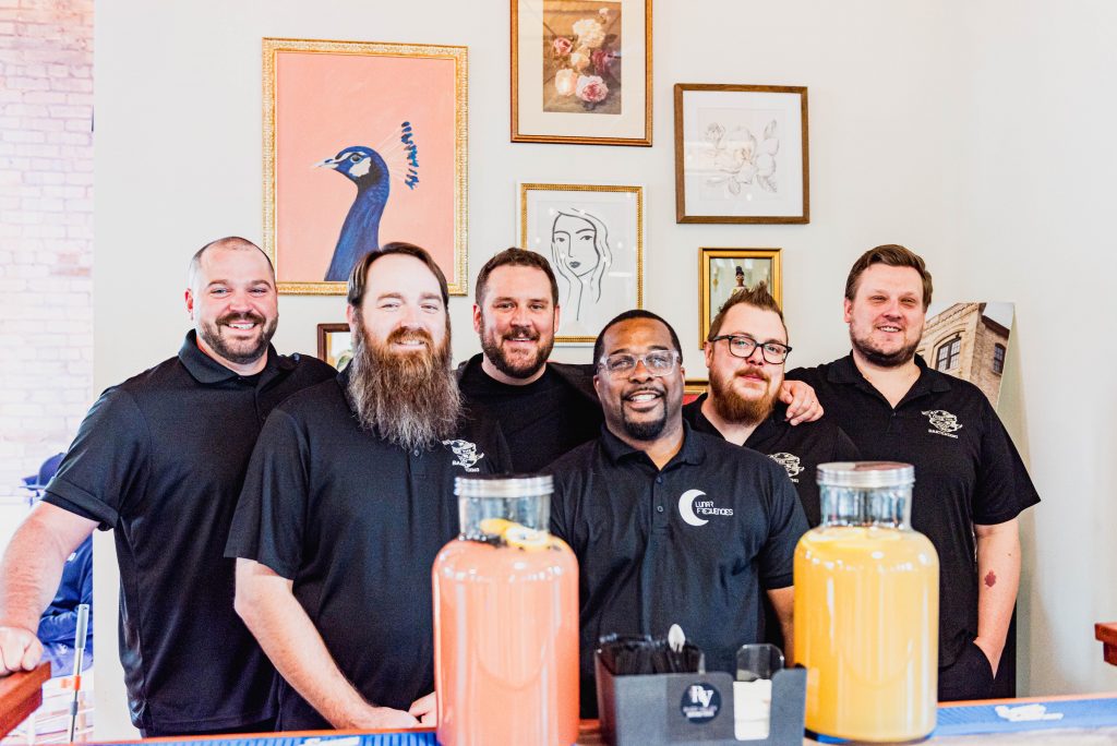 John Crone (center left) with Man on the Moon Events staff. Photo by Caroline Cavalcante Photography