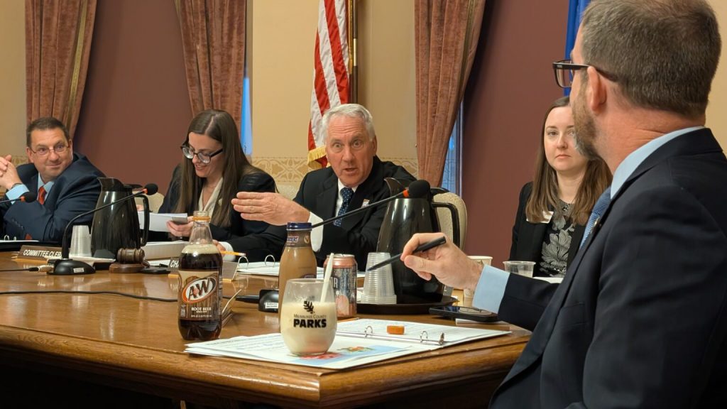 Rep. Dan Knodl (R-Germantown) looks at the root beer float made by Rep. Ryan Clancy (D-Milwaukee) during the Assembly Public Benefit Reform Committee. Clancy made it as he was arguing the definitions in the bill were arbitrary and unclear. (Photo by Baylor Spears/Wisconsin Examiner)