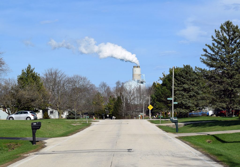 The Oak Creek power plant owned by We Energies can be seen from a nearby residential neighborhood. The utility is proposing to build a gas plant in its place to meet suring energy demand as tech companies build data centers in southeastern Wisconsin. Evan Casey/WPR