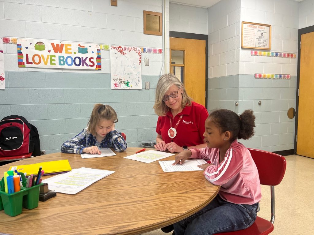 Dawn Orchel tutors Jonah, left, and Jordynn, right, at Milwaukee’s Parkside School for the Arts. Corrinne Hess/WPR