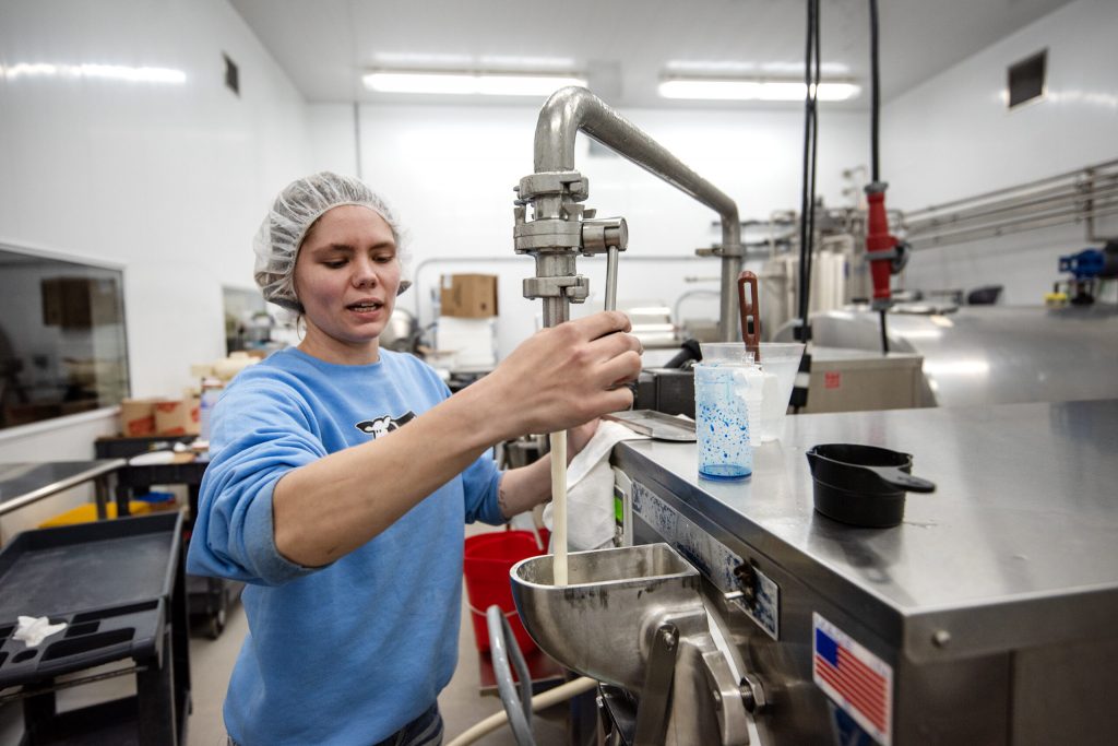 Customers browse different flavors of ice cream Monday, May 12, 2025, at Sassy Cow Creamery in Columbus, Wis. Angela Major/WPR