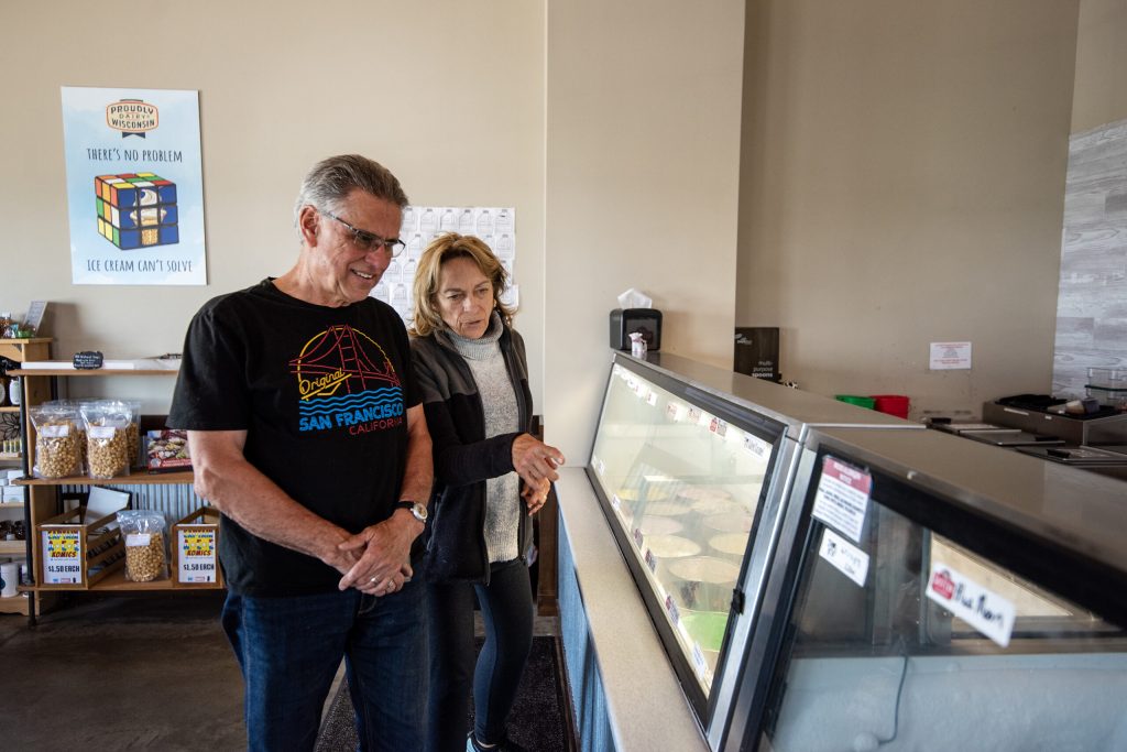 Abe Adelemyer, right, age 4 and his sister, Elodie, age 6, watch as ice cream is made Monday, May 12, 2025, at Sassy Cow Creamery in Columbus, Wis. Angela Major/WPR